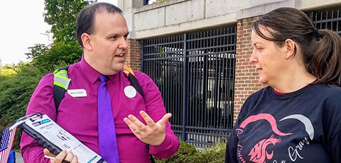 Advocate speaking with an interested person.